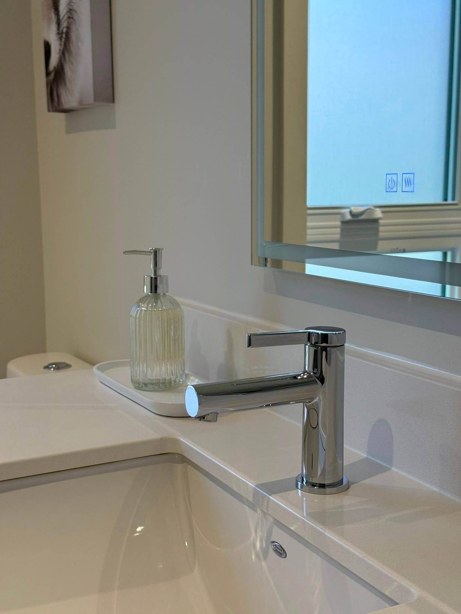 Bathroom vanity wiped down and restocked
