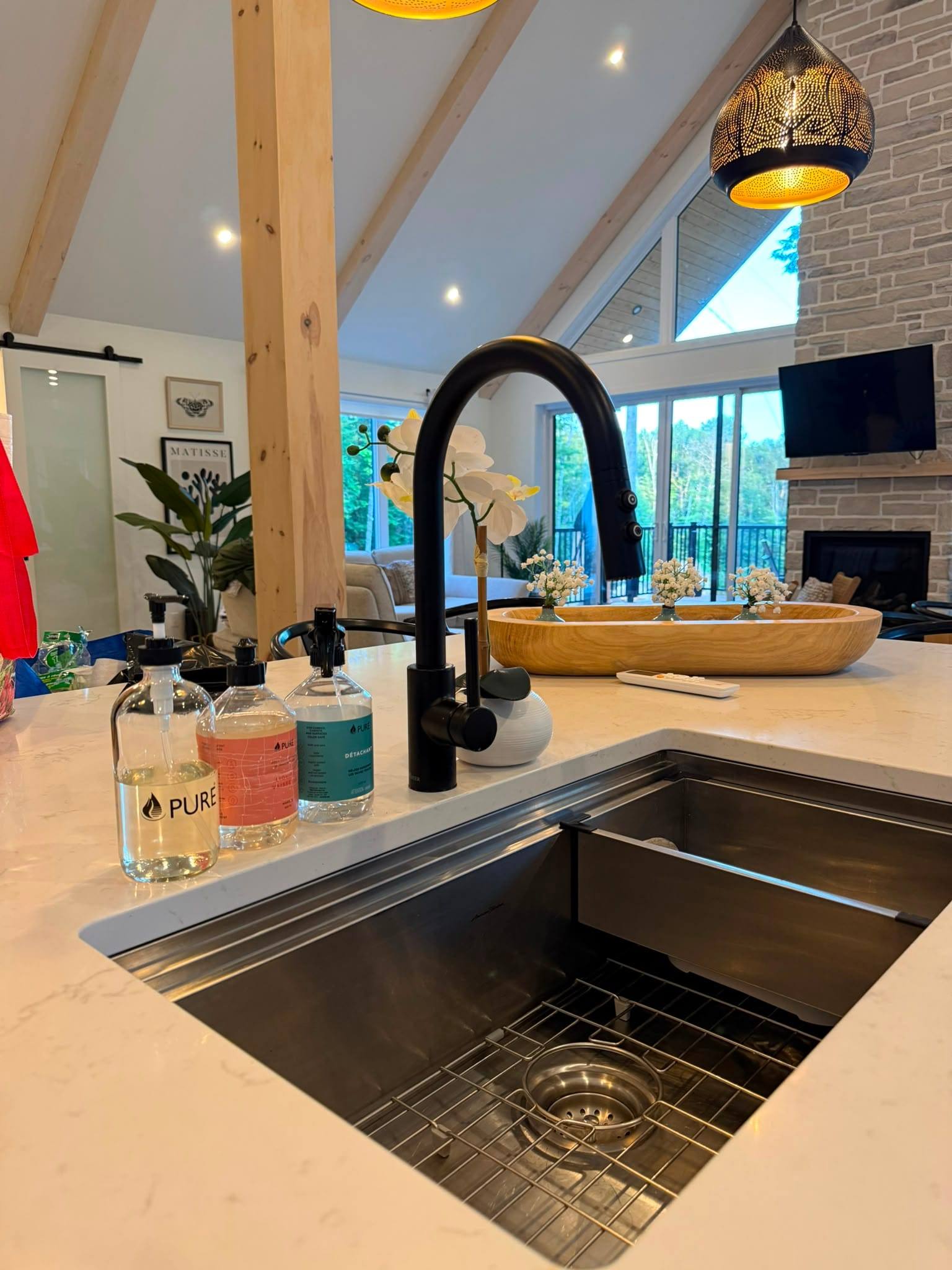 Kitchen island sink cleaned and staged with supplies
